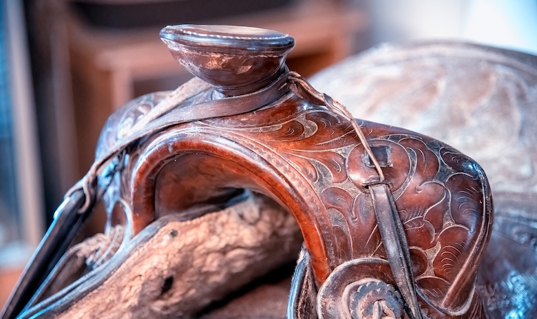 A close up of a leather saddle