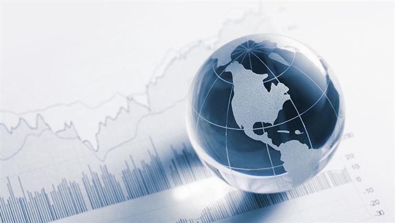 digital 3-d globe with bar chart in background
