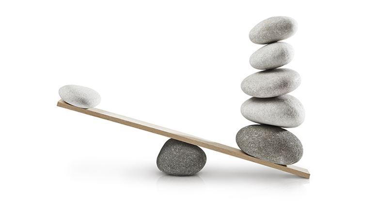 balancing scale with rocks