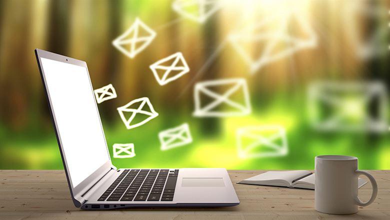 email coming out of a computer screen