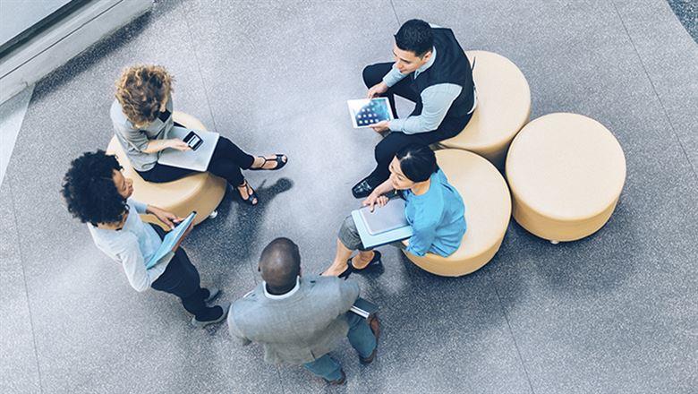 a group of business professionals talking 