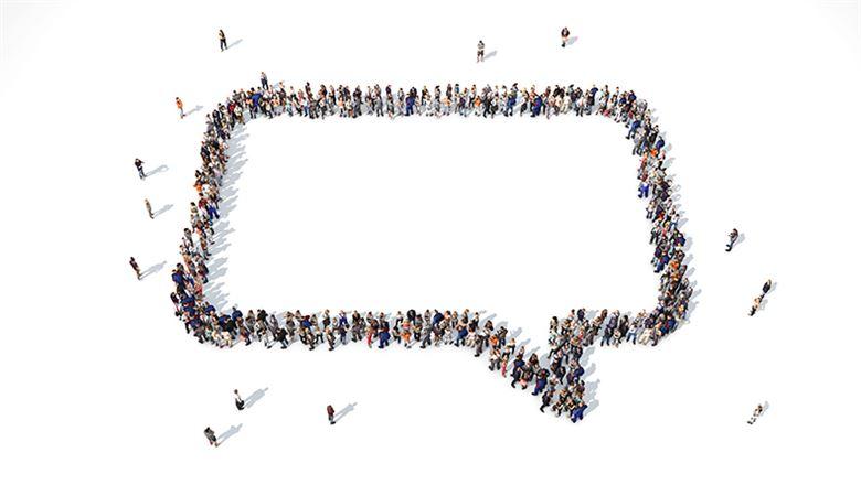 people grouped together in the shape of a chat bubble