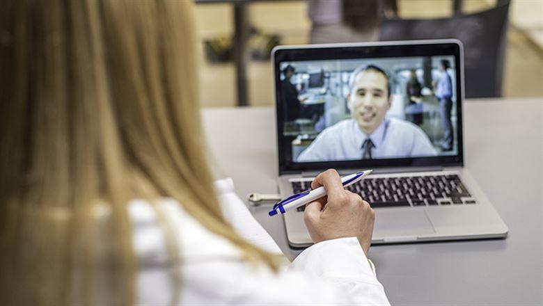 professional having a video conference on laptop