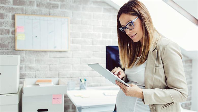 businesswoman on tablet in an office setting