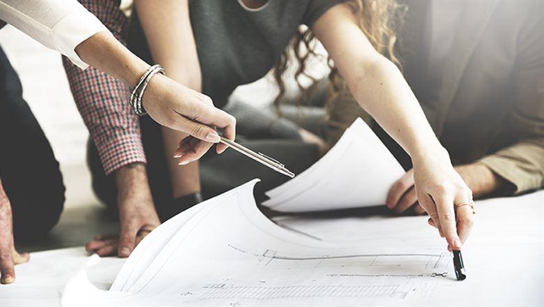 professionals looking at blueprints