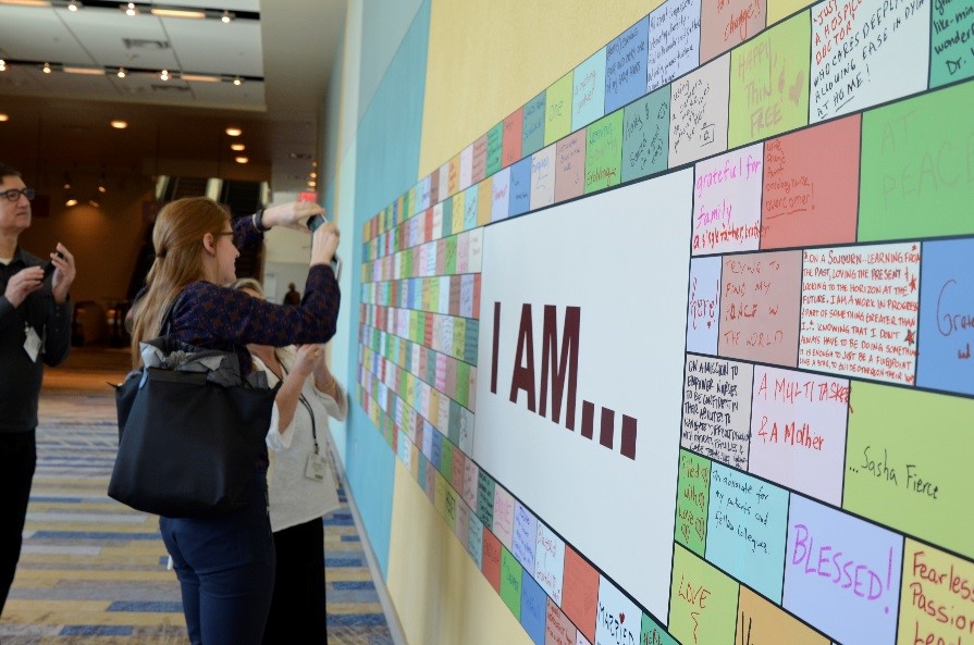 meeting attendees engaging with I Am Wall
