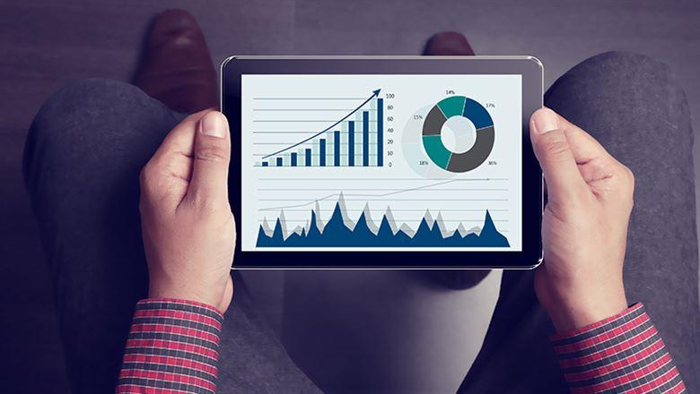 professional viewing data charts on a tablet