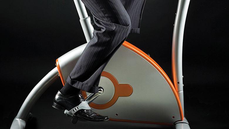 professional in a suit on exercise machine