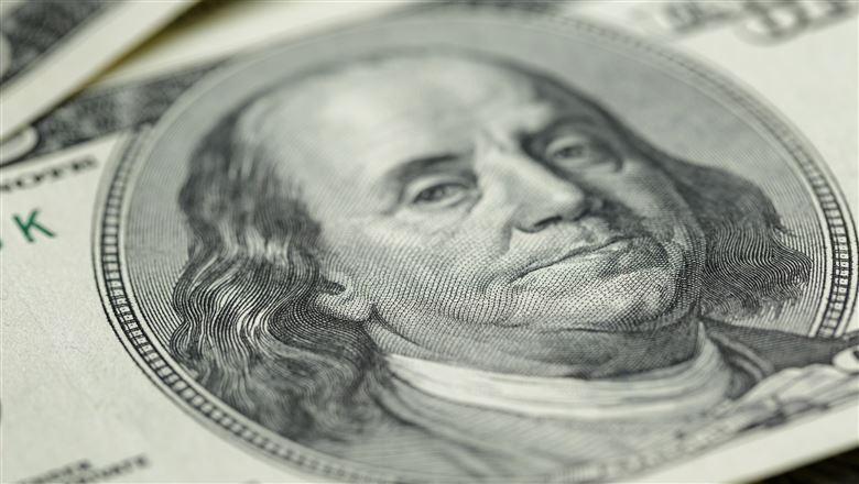 close-up of Benjamin Franklin on one hundred dollar bill