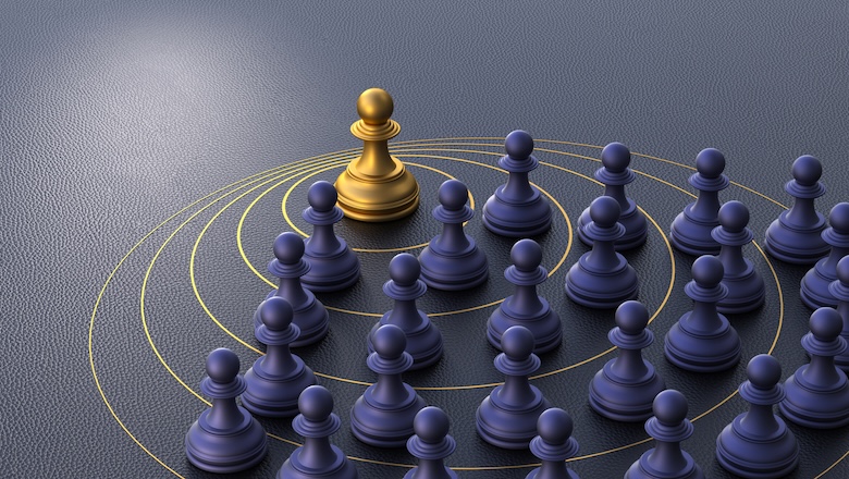 A golden pawn stands at the forefront, confidently leading a group of black pawns along strategic concentric paths. 