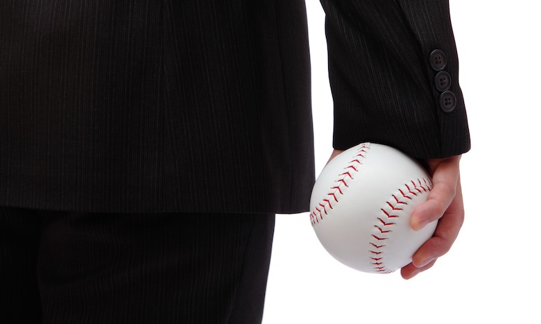 Businessman playing baseball