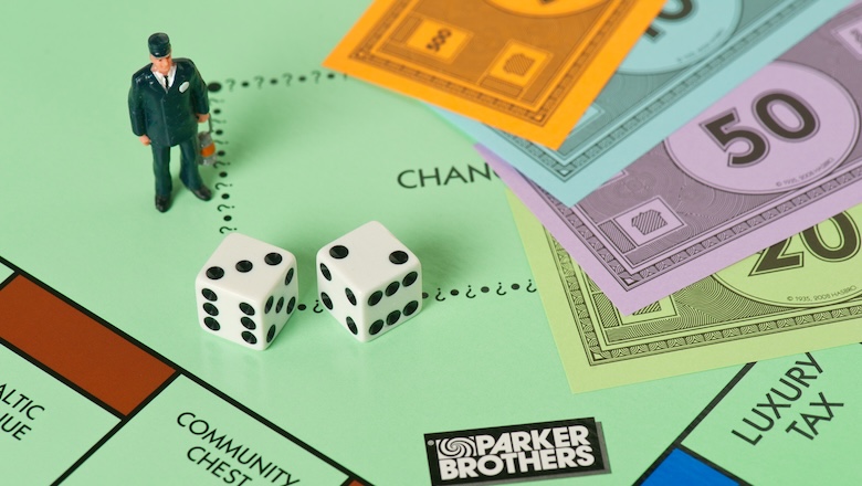 A business man on a monopoly board